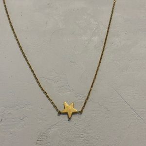 Madewell gold star necklace with clasp closure